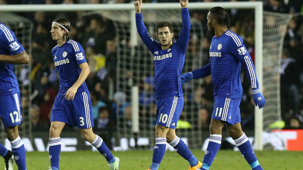 Hazard celebrates a goal with Chelsea in 2014-15 with Filipe Luis and Drugba by his side.