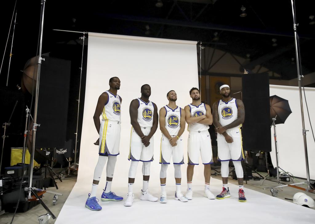 OAKLAND, CA - SEPTEMBER 24: (L-R) Kevin Durant #35, Draymond Green #23, Stephen Curry #30, Klay Thompson #11, and DeMarcus Cousins #0 of the Golden State Warriors pose for a group picture during the Golden State Warriors media day on September 24, 2018 in Oakland, California. (Photo by Ezra Shaw/Getty Images)