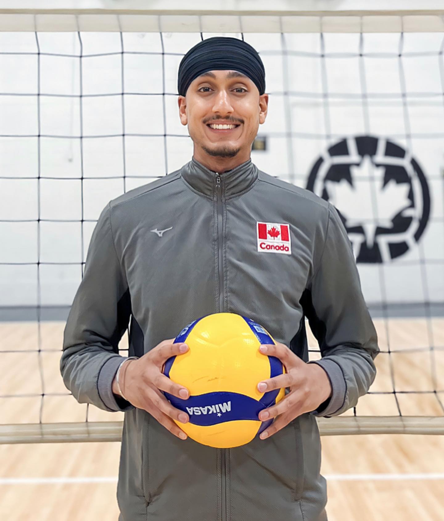 Navreet Singh Suhan poses in his Canadian team uniform and turban.