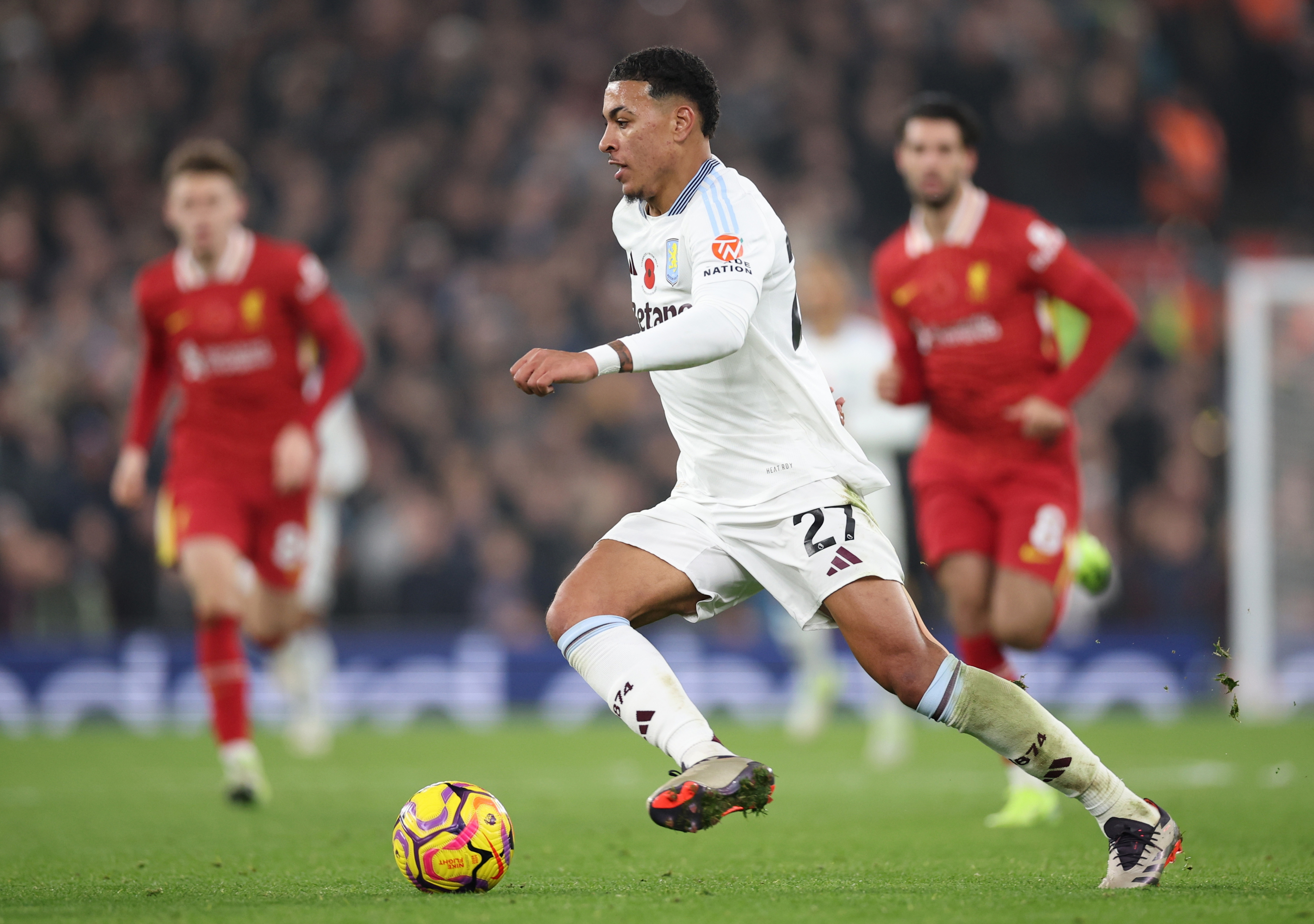 Morgan Rogers dribbling the ball during a match against Liverpool