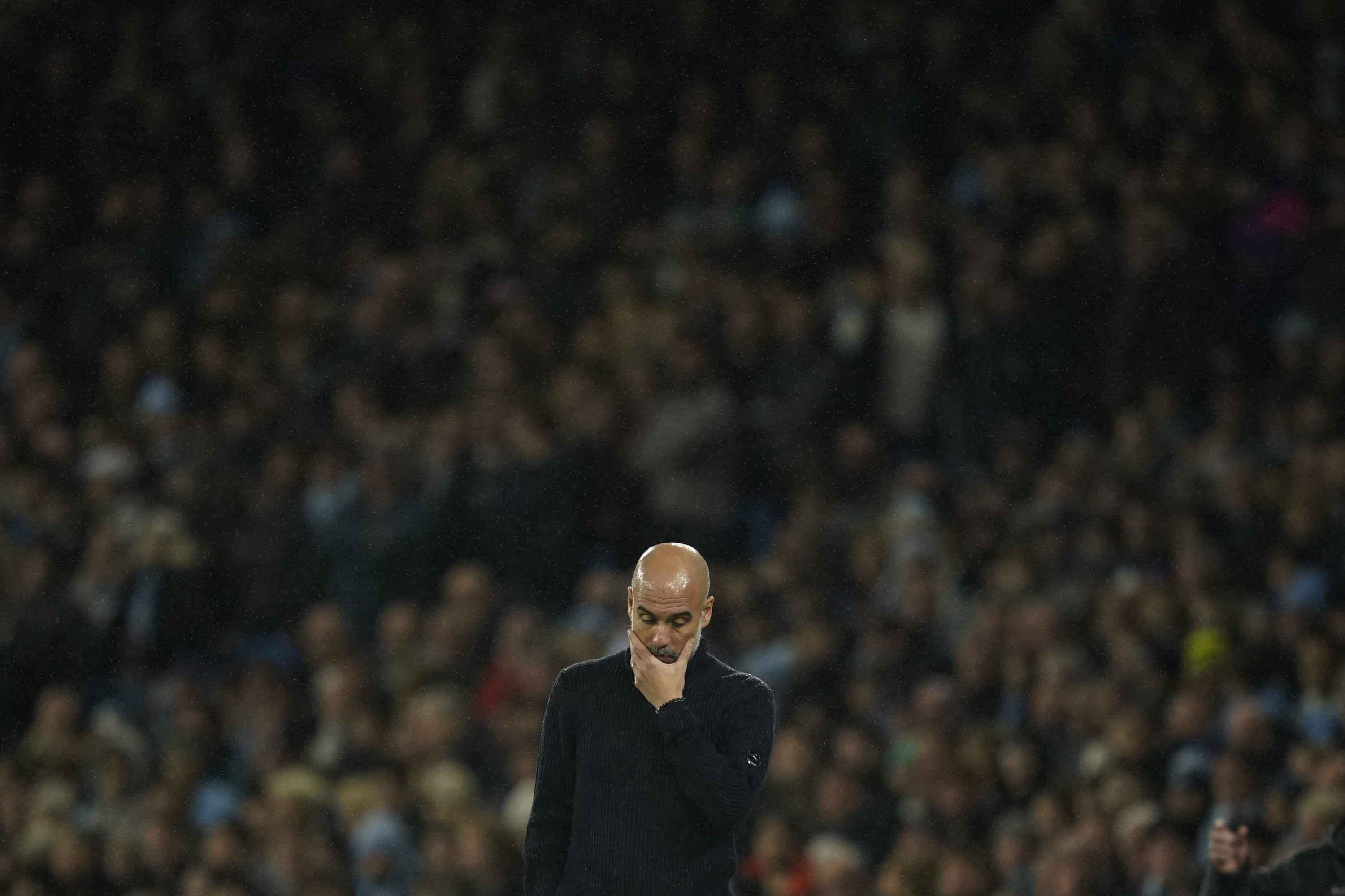 Guardiola, dejected by his team's defeat to Tottenham.