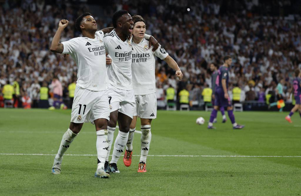 Rodrygo, Vinicius and Fran García celebrate a Real Madrid goal.