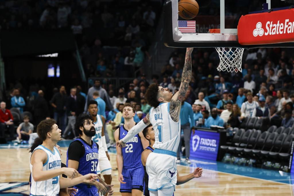 Charlotte Hornets guard LaMelo Ball (1) drives to the basket against the Orlando Magic during the second half of an NBA basketball game in Charlotte, N.C., Monday, Nov. 25, 2024. (AP Photo / Nell Redmond)