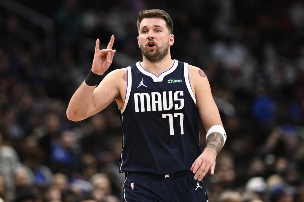 Dallas Mavericks guard Luka Doncic (77) gestures during the second half of an NBA basketball game against the Washington Wizards, Thursday, Dec. 5, 2024, in Washington. The Mavericks won 137-101. (AP Photo/Nick Wass)