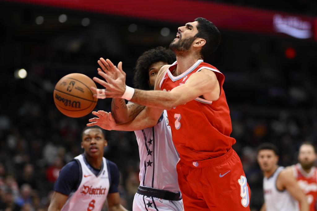 Memphis Grizzlies forward Santi Aldama (7) loses the ball against Washington Wizards forward Marvin Bagley III, center left, during the first half of an NBA basketball game, Sunday, Dec. 8, 2024, in Washington. (AP Photo/Nick Wass)