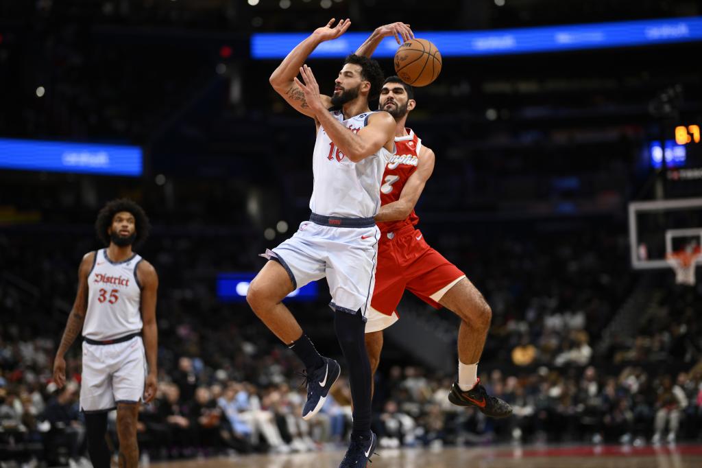 Memphis Grizzlies forward Santi Aldama (7) blocks a shot by Washington Wizards forward Anthony Gill (16) during the second half of an NBA basketball game, Sunday, Dec. 8, 2024, in Washington. (AP Photo/Nick Wass)