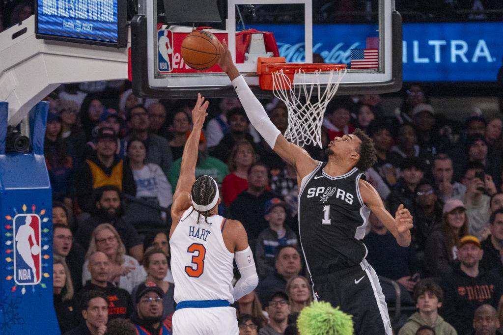 Wembanyama blocks Josh Hart's shot.