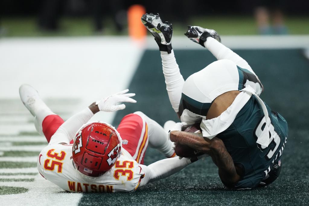 Philadelphia Eagles wide receiver DeVonta Smith scores a touchdown as Kansas City Chiefs cornerback Jaylen Watson (35) defends during the second half of the NFL Super Bowl 59 football game, Sunday, Feb. 9, 2025, in New Orleans. (AP Photo/Brynn Anderson)