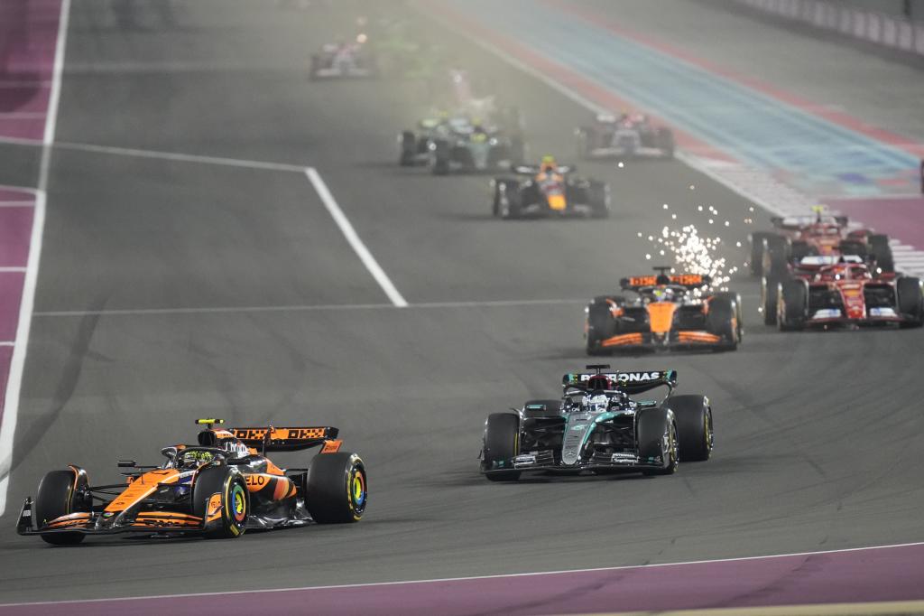 FILE -McLaren driver Lando Norris of Britain, left, in action during the Qatar Formula One Grand Prix at the Lusail International Circuit in Lusail, Qatar, Dec. 1, 2024. (AP Photo/Darko Bandic), File)