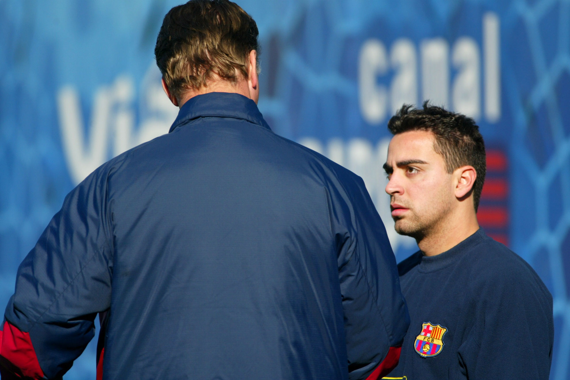 Xavi talks to Van Gaal.