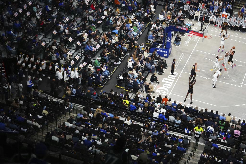 Devin Booker launches to the basket in a zenith image of the game.