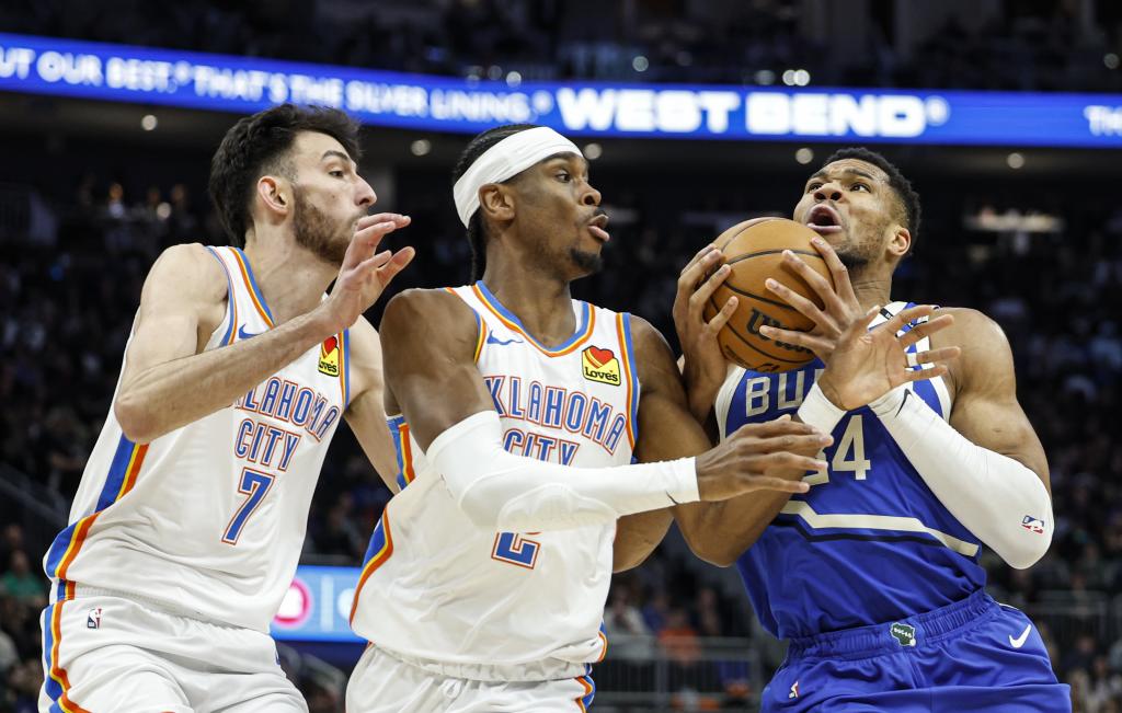 Giannis antetokounmpo defends against Shai Gilgeous-Alexander and Chet Holmgren
