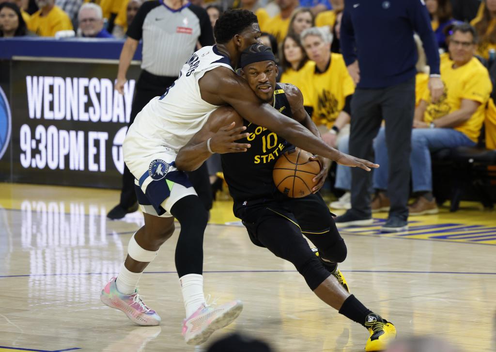 Jimmy Butler tries to overcome Anthony Edwards in a Warriors-Wolves.