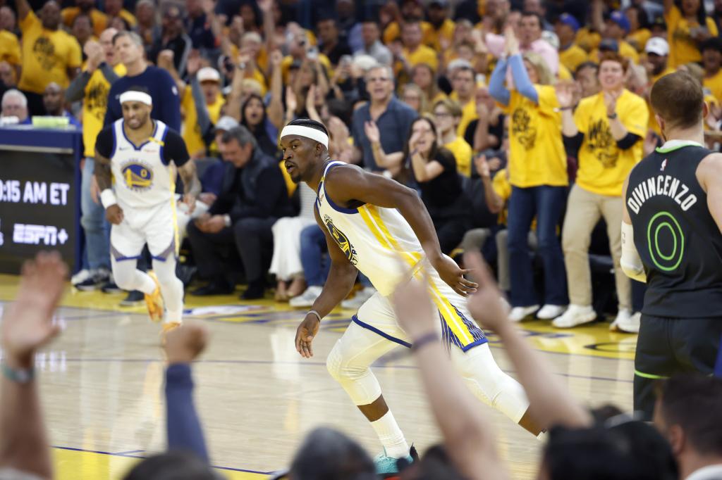 Butler begins the defensive transition after scoring a basket with the Warriors.
