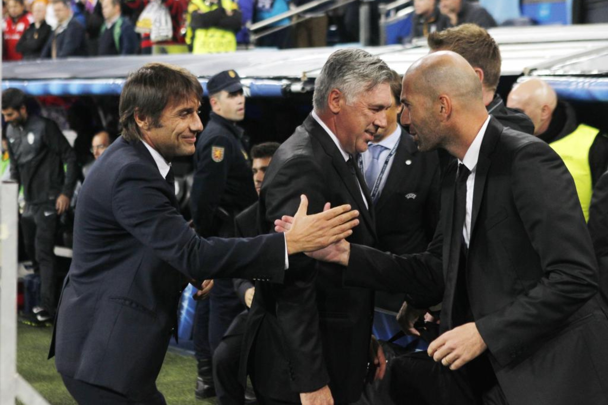 Antonio is greets Zidane and Ancelotti in a match between Juventus and Real Madrid.