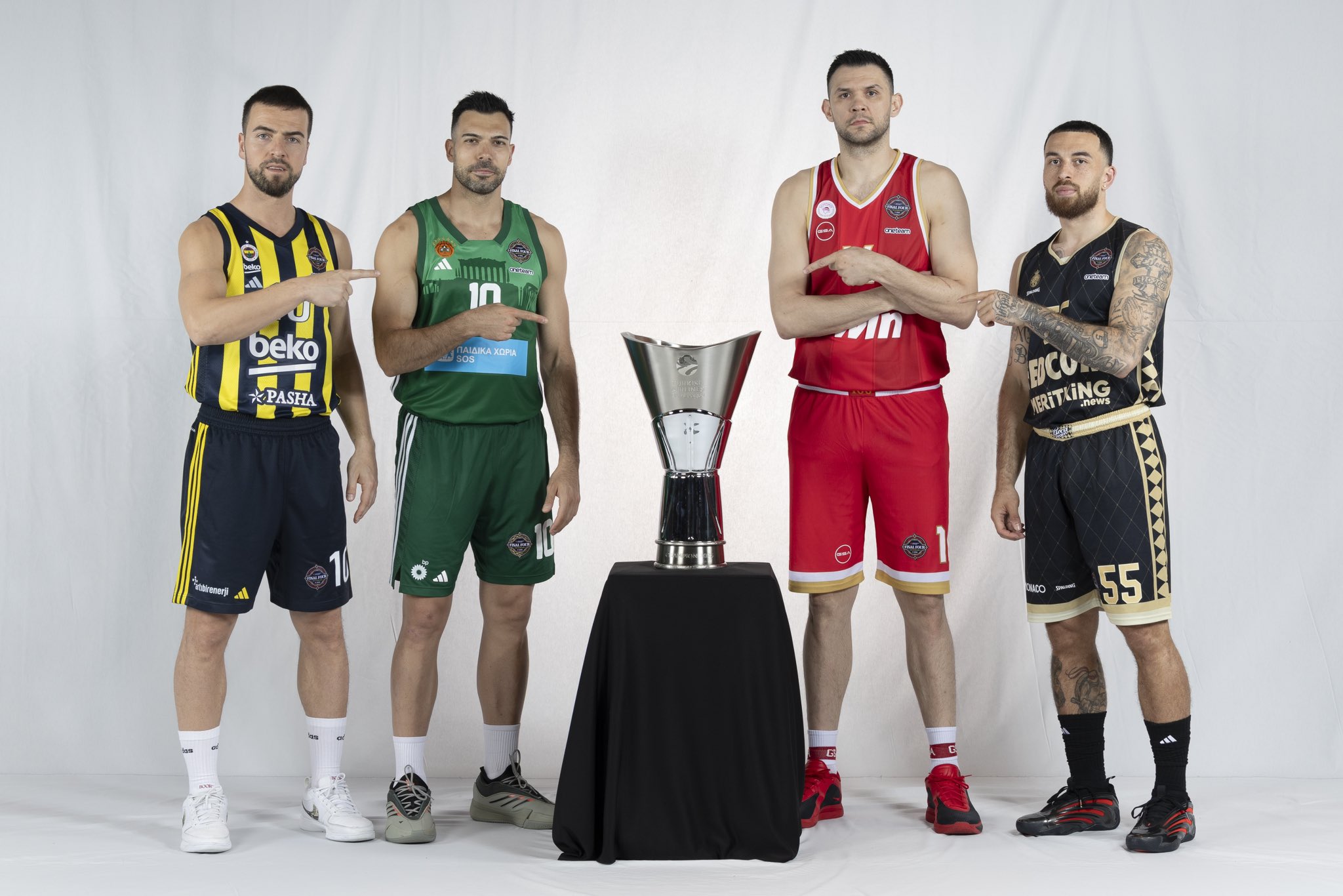 Melih Mahmutoglu, Kostas Sloukas, Kostas Papanikolau and Mike James, captains of the four participants, with the Euroleague trophy.