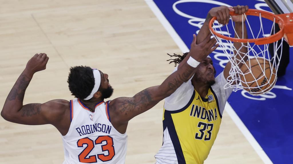 Myles Turner makes a mate before Mitchell Robinson's defense.