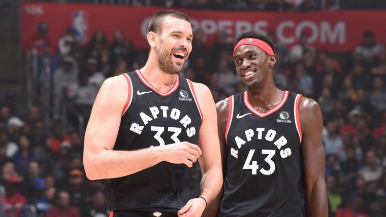 Pascal Siakam jokes with Marc Gasol during a match.