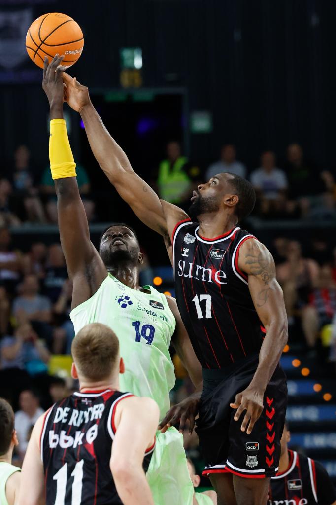 Marvin Jones and Youssoupha Fall fight for a rebound.
