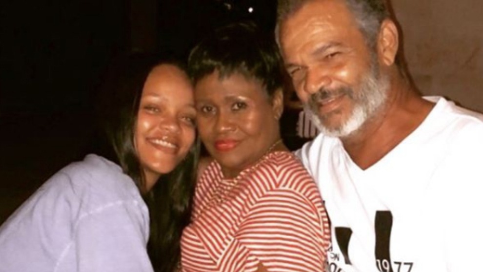 Rihanna, next to her father.