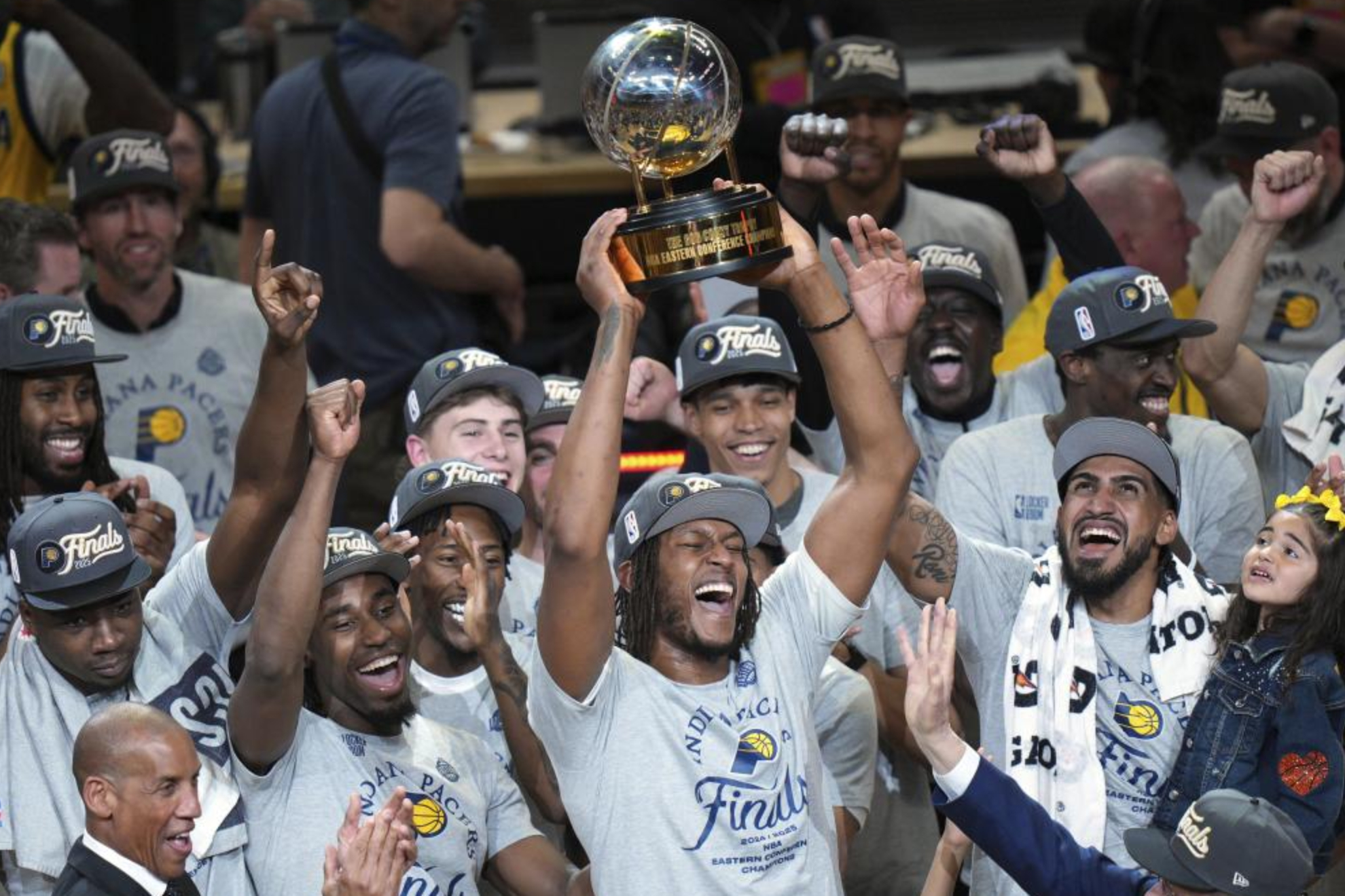Myles Turner lifts the East Champion Trophy to the sky of Indiana.