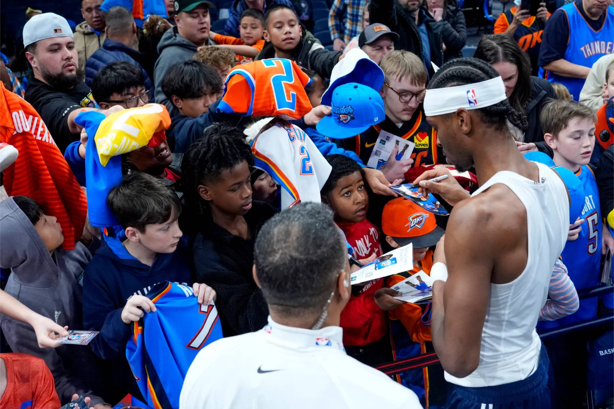 Shai Gilgeous-Alexander, signing autographs.
