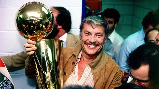 Jerry Buss, with the NBA champion trophy.