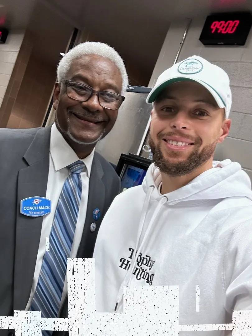'Coach Mack' posing with Stephen Curry, star of the Warriors.