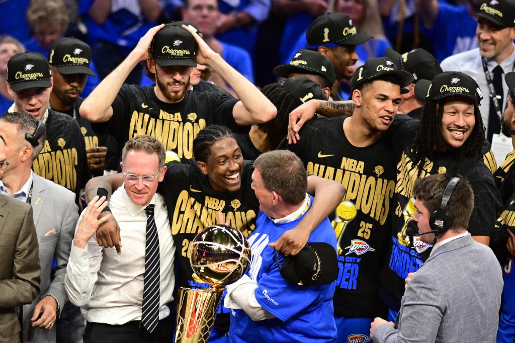 Sam Presti with Jalen Williams in the celebration of the ring