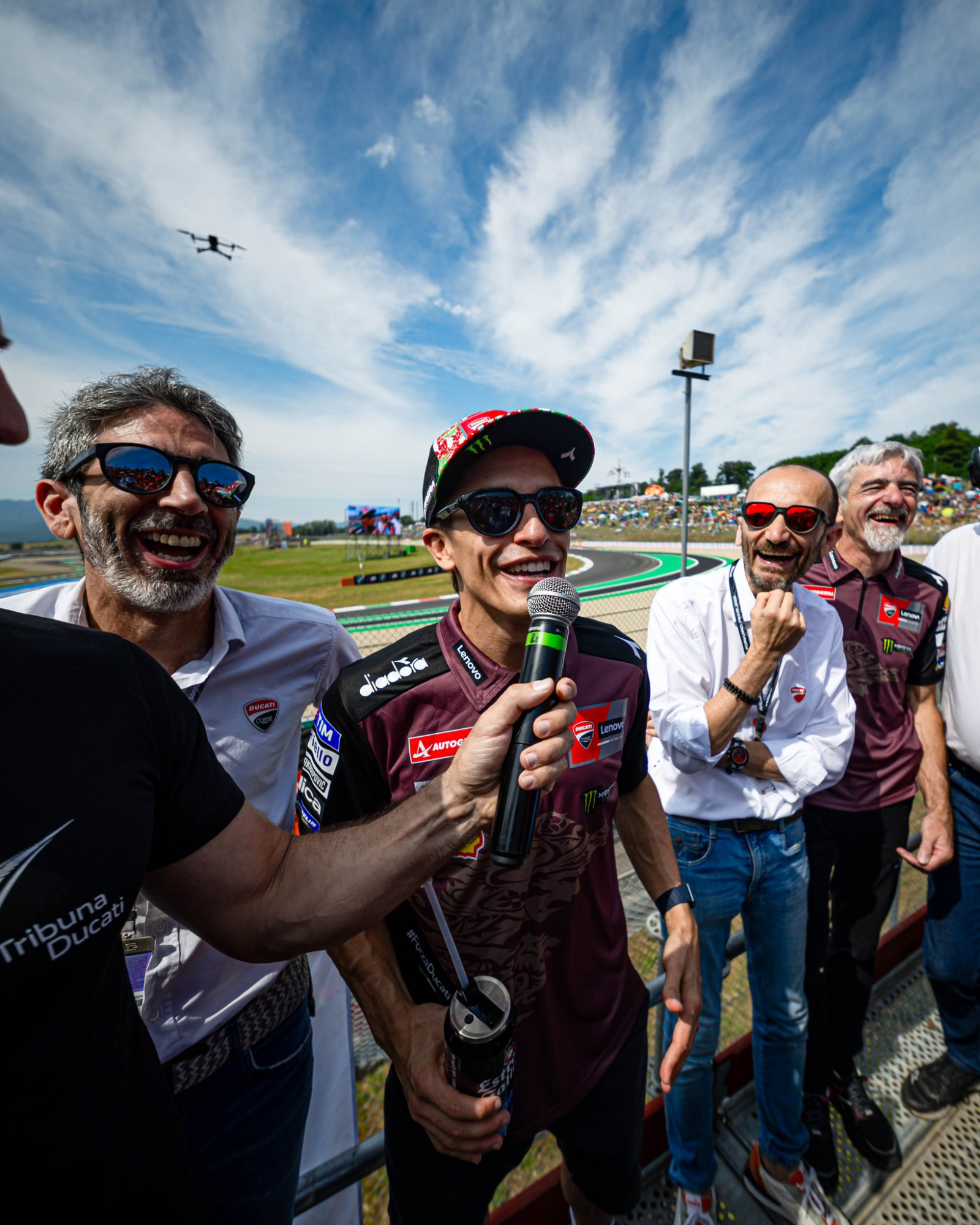 Milizia, Marc Márquez, Domenicali y Dall'Igna, en la tribuna Ducati.