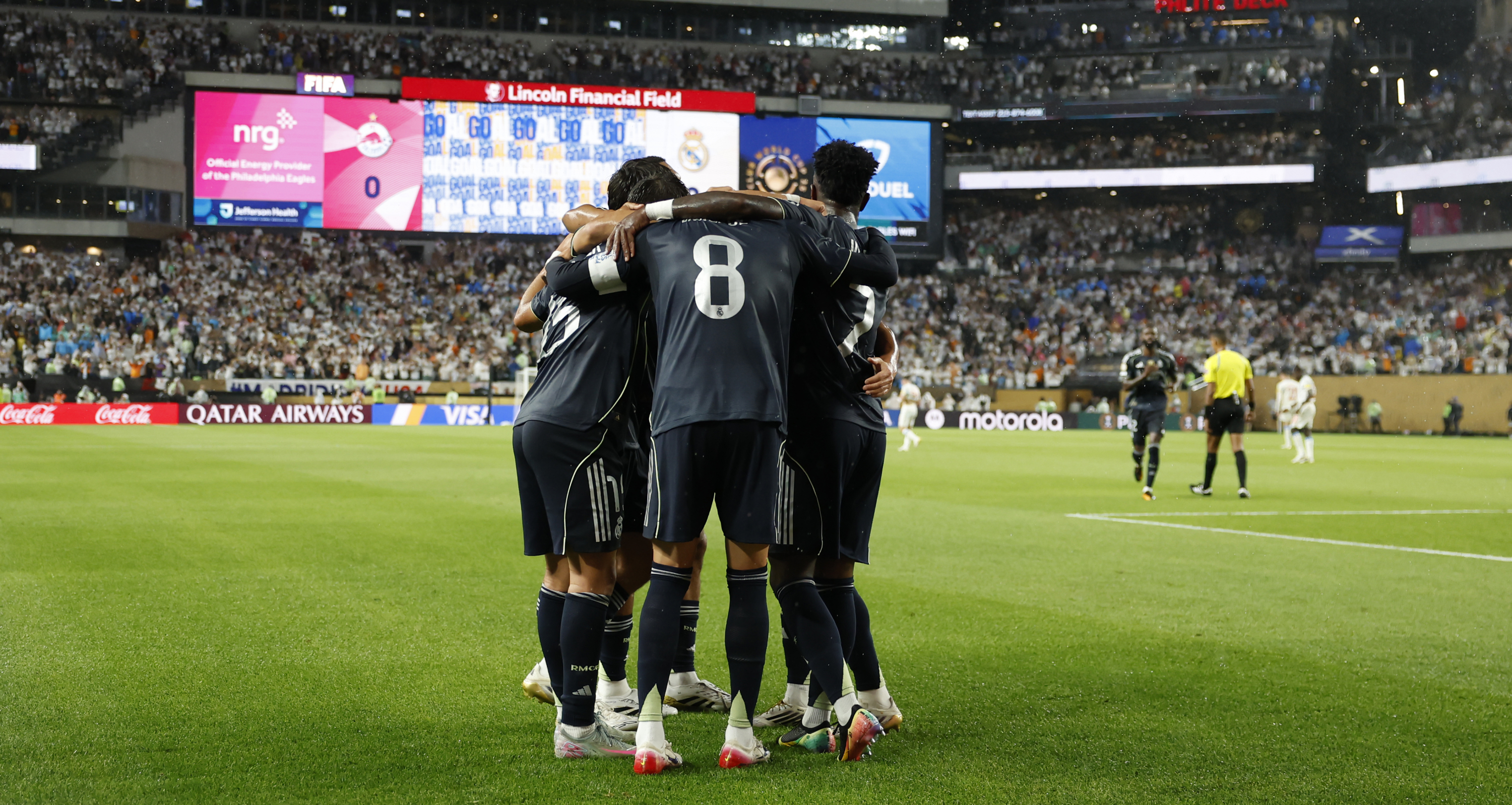 Real Madrid players celebrate Valverde's goal against Salzburg.
