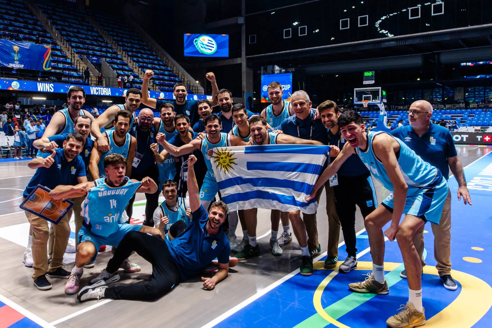 The Uruguay basketball team celebrates the triumph over the United States.